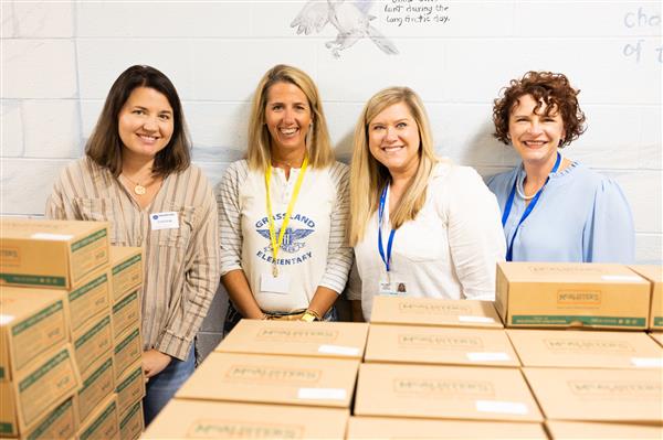 Parent volunteers helping at Grandparents Day